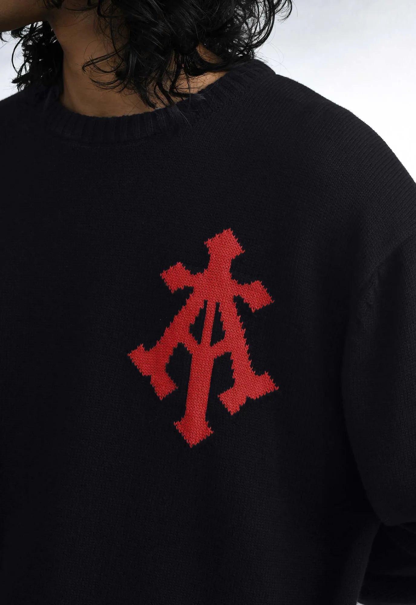 Alpha Cross Knit Sweater In Black